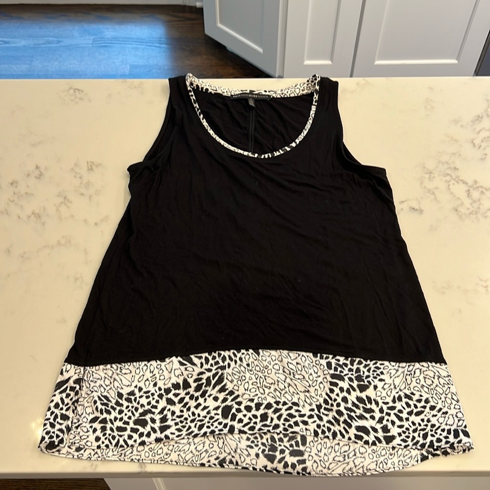 WHBM Women’s black sleeveless top with animal print liner at bottom. Size small